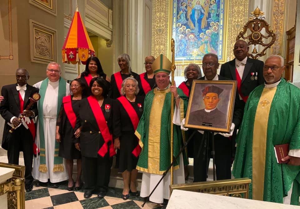 Archbishop Nelson Perez of Philadelphia gathers with members of his archdiocese’s chapter of the Tolton Ambassadors, a group dedicated to promoting Venerable Father Augustus Tolton’s sainthood cause, after a June 26 Mass in Fr. Tolton’s honor in the Cathedral Basilica of Ss. Peter and Paul in Philadelphia.